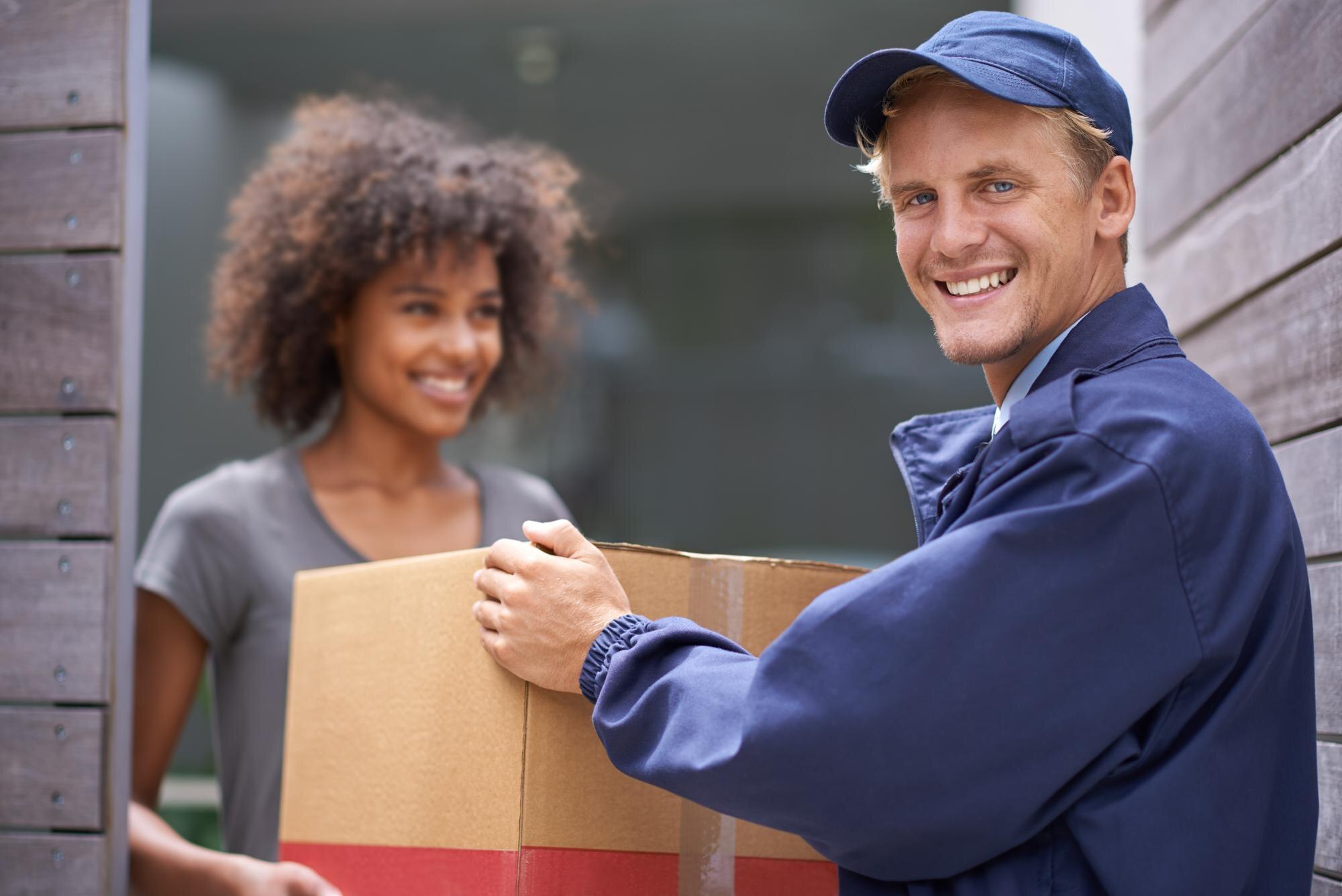 delivering-direct-your-door-shot-courier-making-delivery-smiling-customer-590464-8843.jpg